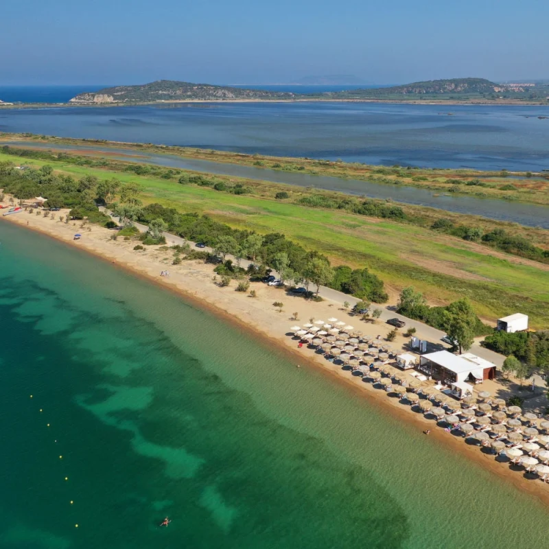 Panoramic shot of the Gialova Lagoon in Messinia, a vital wildlife habitat featuring a serene water landscape with a rich biodiversity, including rare bird species.