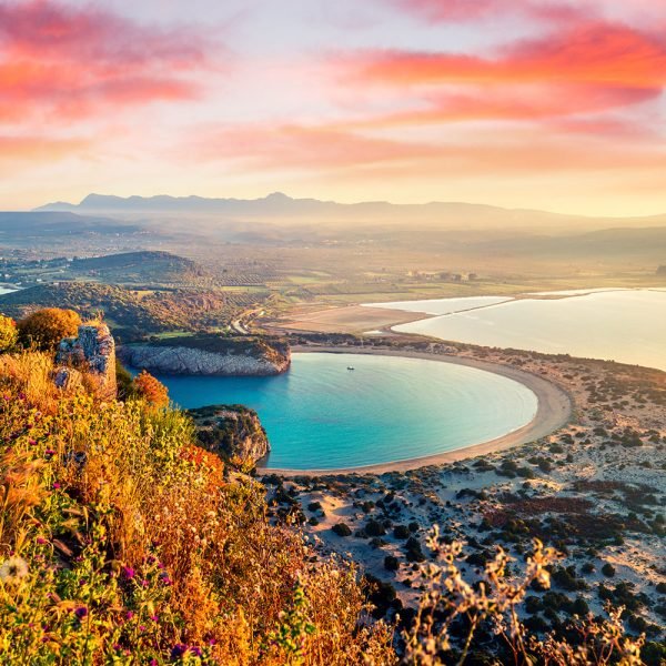 Majestic view of the Castle of Pylos, also known as Niokastro, in Greece, highlighting its historic fortifications overlooking the Ionian Sea, a landmark of medieval architecture and history.